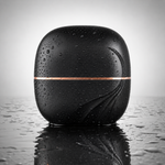Pocket Bunny Mini Hair Brush it in stylish black design with water droplets on surface.